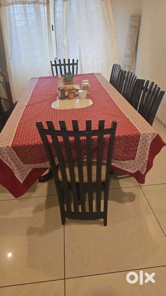 An 8 seater dining table with glass top