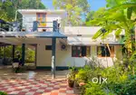 1 acre land with House. Selling as house plot also.1 km to Koppam Town