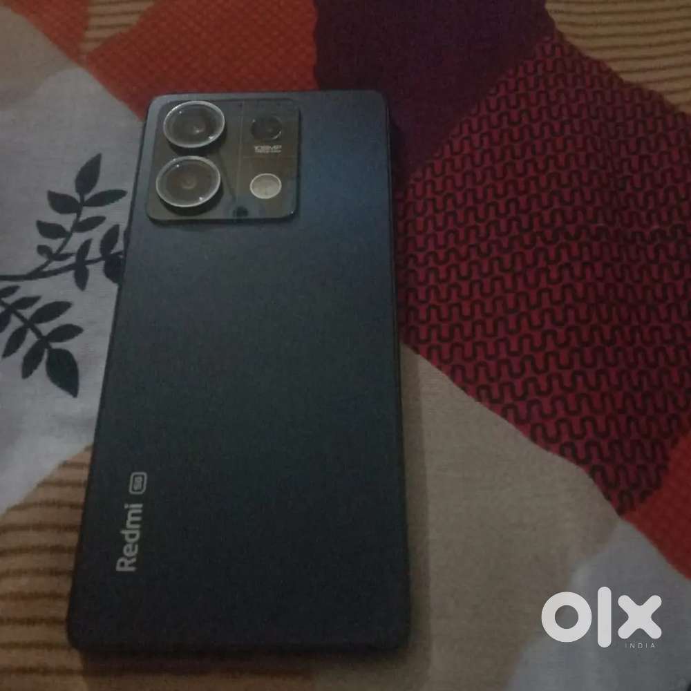 Redmi not 13 colour black hai phone good condition me hai ram,6,128