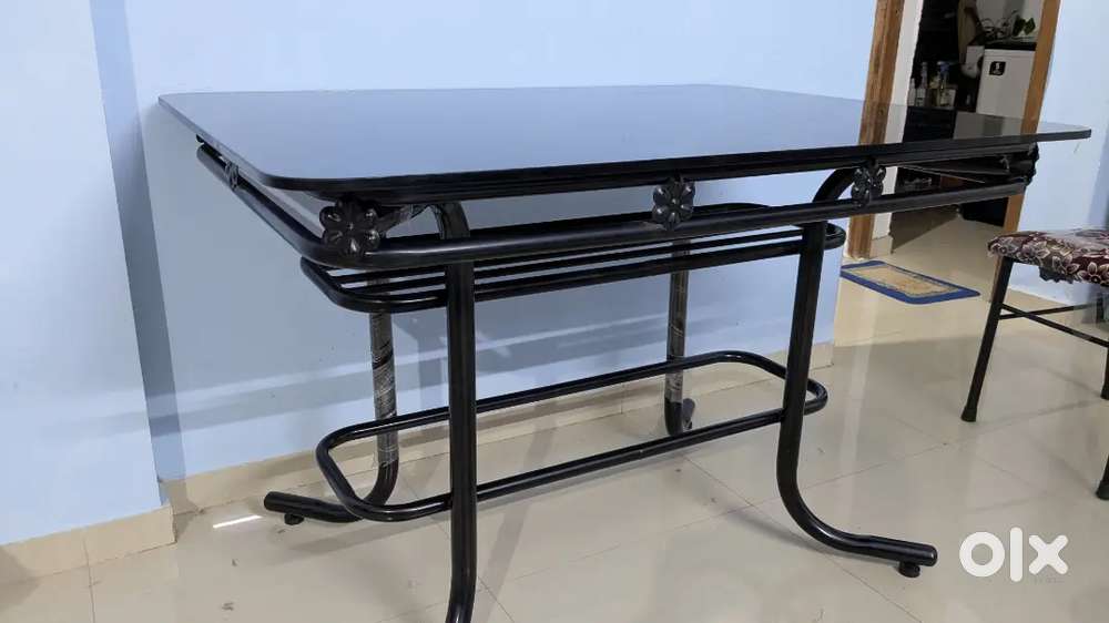 One year old Glass top four seater Dining table with chair