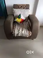Single sofa chair and glass center table