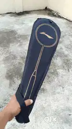 Adrenex, black orange Racquet.