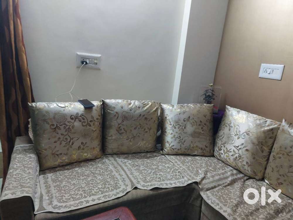 L shape Sofa with divider and 2 puffy seats