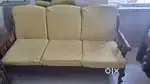 3 seater Original Shegun Wood Sofa with decor company cover.
