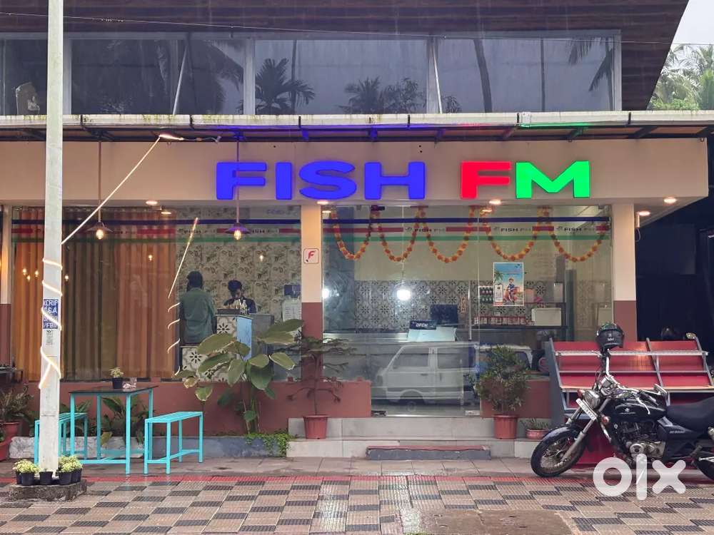 Butcher at fish and meat retail shop