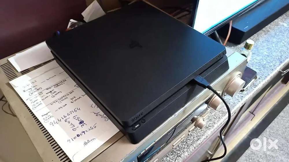 PS4 console with controller, games