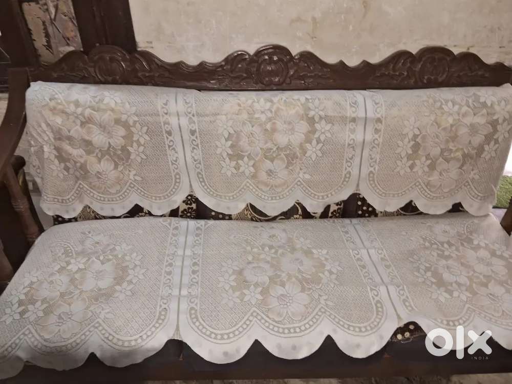 Five seater sofa set with table and wooden wardrobs.