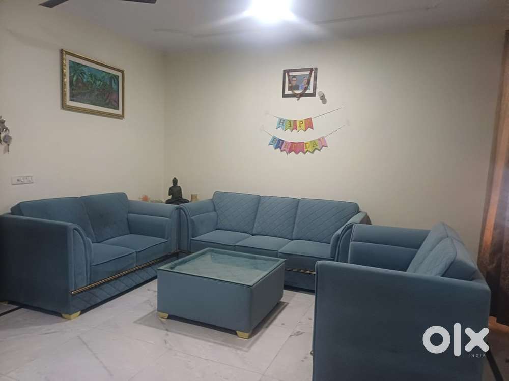 Available for sale one year old sofa 7 seater with Center table