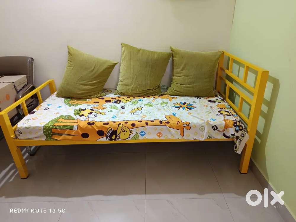 Yellow colour metal 3x6 single bed with a new mattress