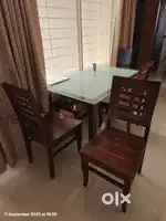 Dining table with four chairs and bench