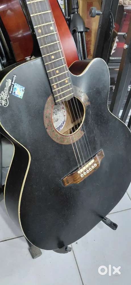 Acoustic  guitar with bag and belt and plectrum