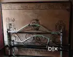 Queen sized steel cot with bed