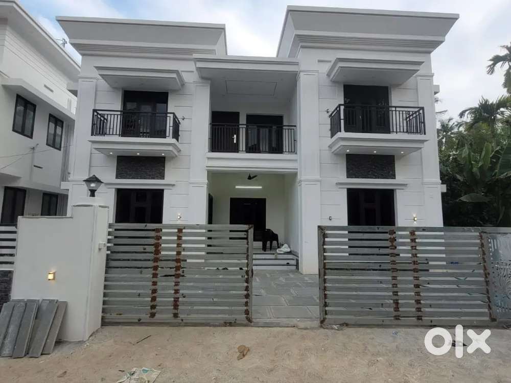 AN ELEGANT NEW 4BED ROOM 2150SQ FT VILLA IN MANNUTHY,THRISSUR