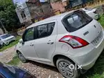White colour  swift vxi petrol  single  hand 1st owner