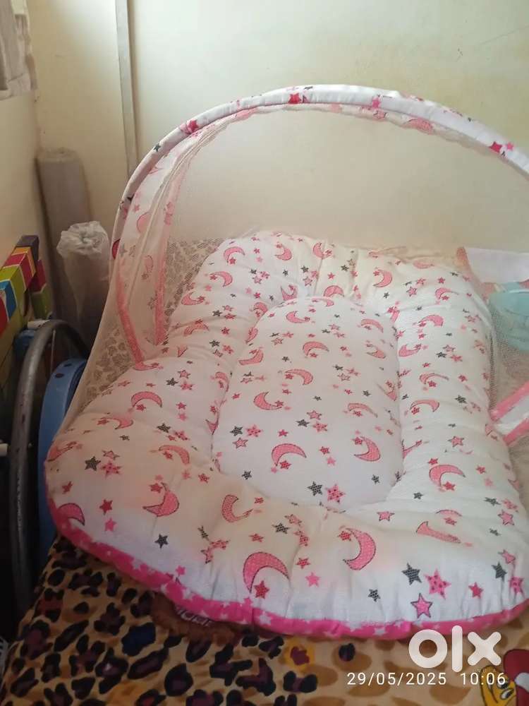 Bed with mosquito net