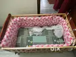 Babyhug wooden crib cot with mosquito net