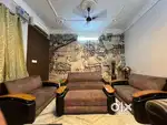 Comfortable Sofa with Wooden Armrests – Good Condition