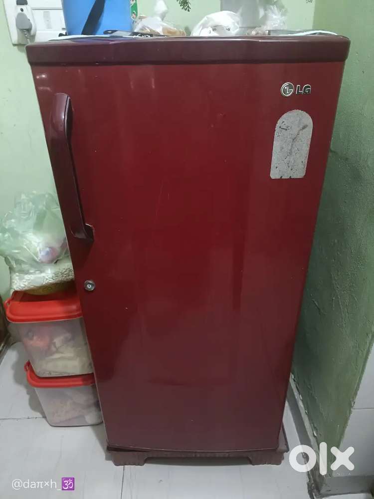 A small fridge but it is broken the cabinet for water bottle r broken