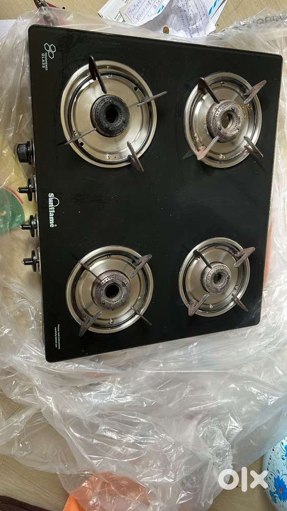 1 gas stove, 3 boxes(iron), curtains, flower pot