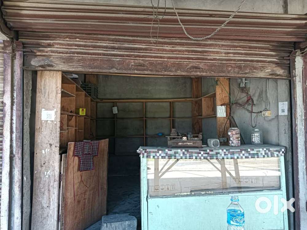 Attached with fridge and along  with wooden rack