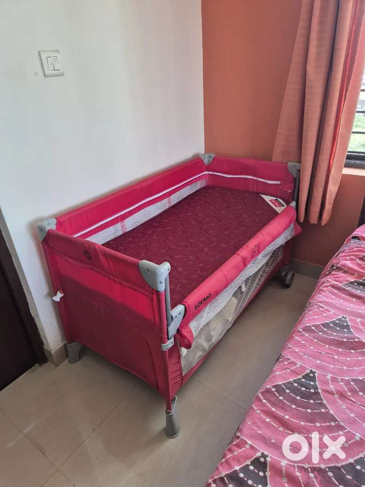 Bedside crib with mattress  pink color (Solimo brand) Not used