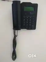 BSNL landline phone and Router with modem.