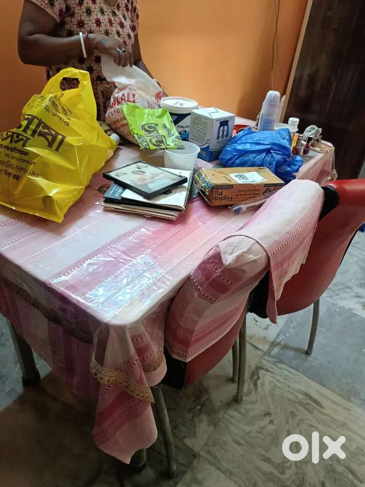 Selling a 4 seater rod iron dining table with 2 chairs