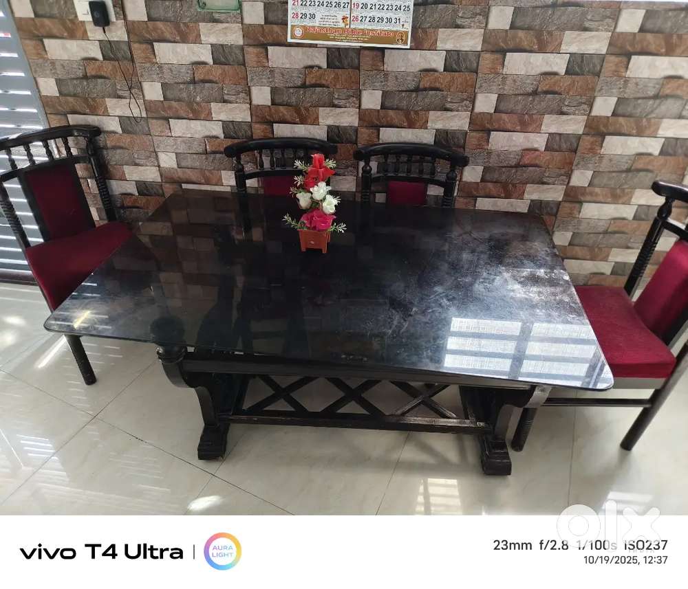 Wooden Dining table 6 Seater with glass top.