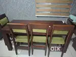 Mahagani wood dining table with 4 chairs and 1 bench.
