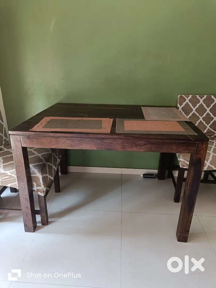 want to sell solid wooden 4 seater dining table with 4 chairs
