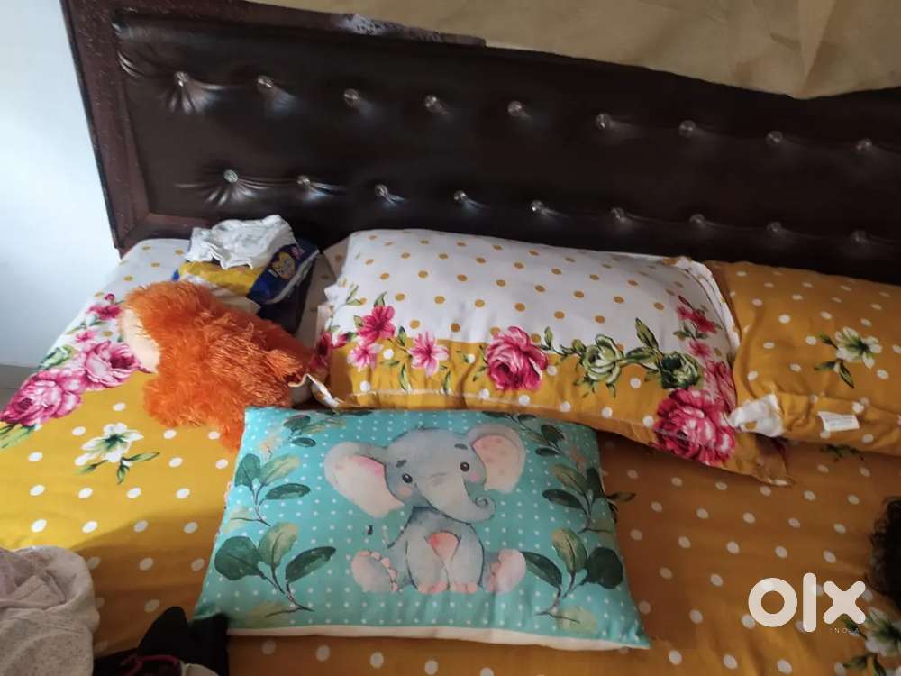 Bed with mattress and cupboard