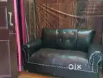 Sofa in black colour and including table with sofa all things are good
