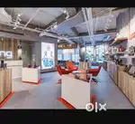 Male consumer loan Department staffs at home appliances showroom