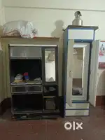 2 cupboards (1 heavy guage 7 feet steel cupboard and 1 wooden tv unit)
