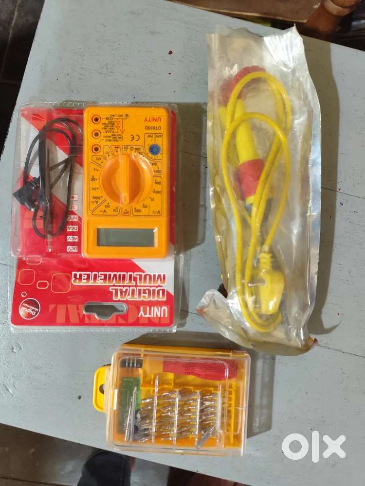 Soldering gun, multimeter and multi purpose screw driver