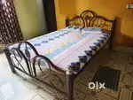 Double bed with mattress and rack