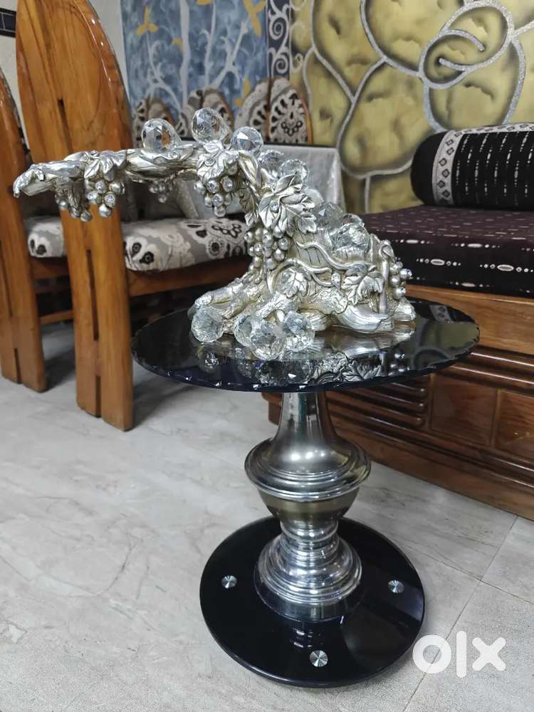 Side table with decorative showpiece