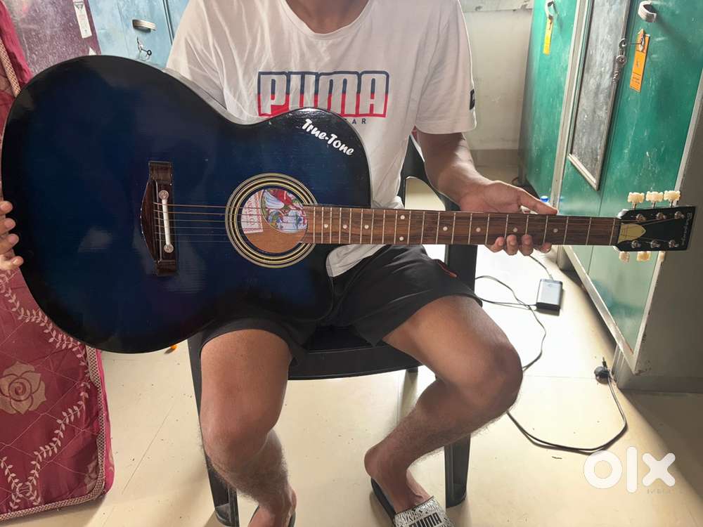 Dark blue glossy fine tone acoustic guitar