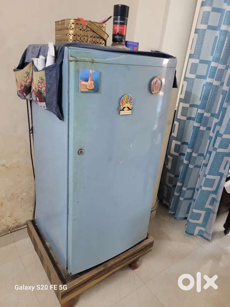 Kelvinator refrigerator in with wooden stand.