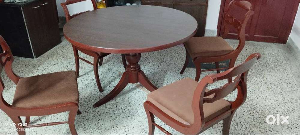 4 chairs along with a dining table