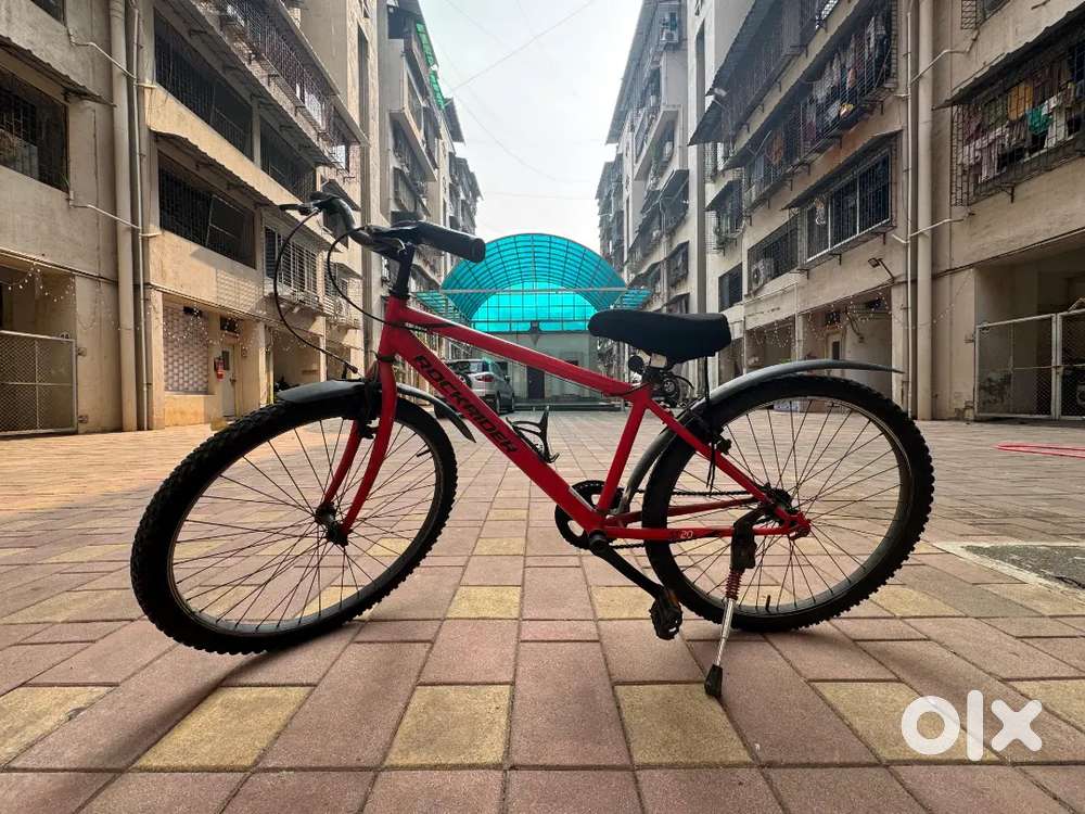 ROCKRIDER ST20 red colour cycle with seat cover.