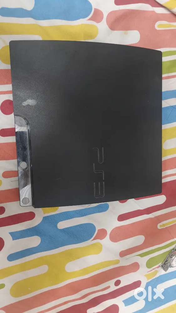 Play station 3 super slim with 15+ games + 2 gaming controllers )