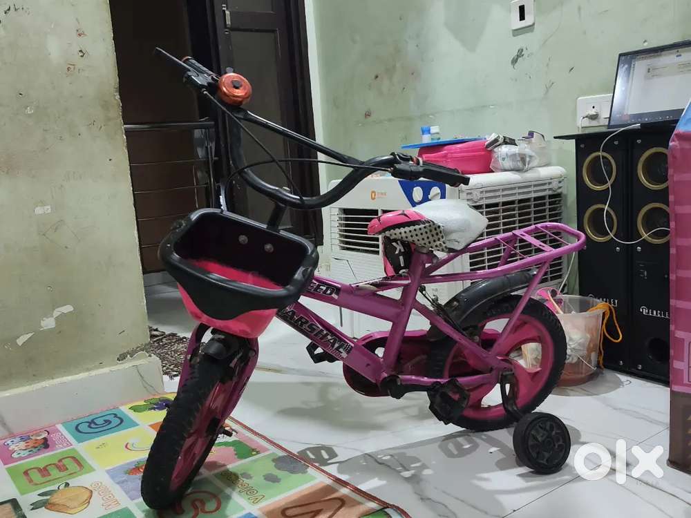 Small kids play bicycle