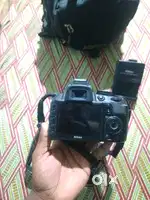Nikon d3100 les18-55 बैटरी चेंजर बाग