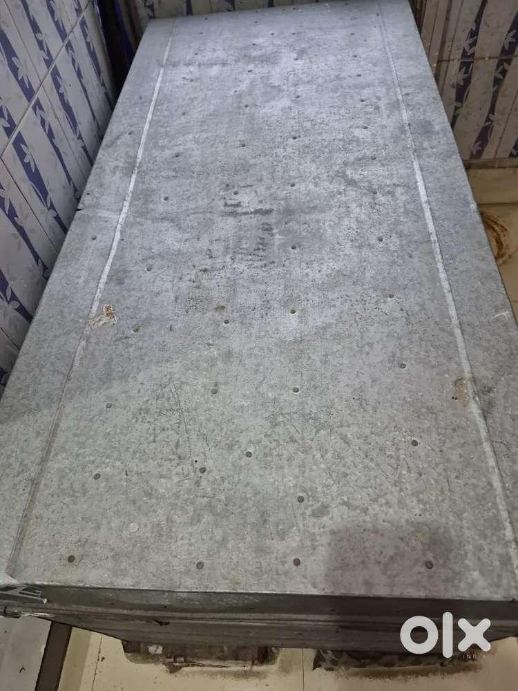 Old large steel trunk, computer table two stool