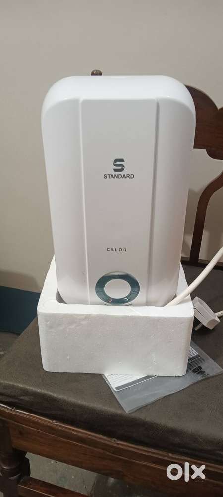 Electric instant water geyser