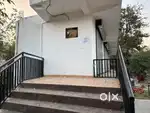A newly constructed  building with three rooms and one hall for rent