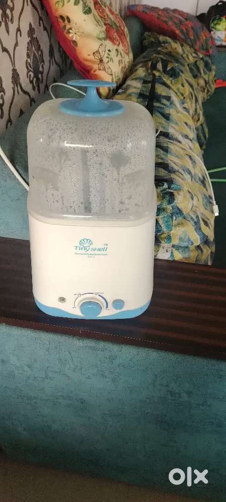 Tiny shell bottle warmer and egg boiler