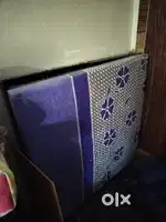 Iron bed with attached mattress