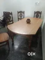 Used dining table and iron almari for sale